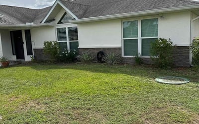 Photo of Aminah W.'s yard after getting lawn care in Hobe Sound, FL