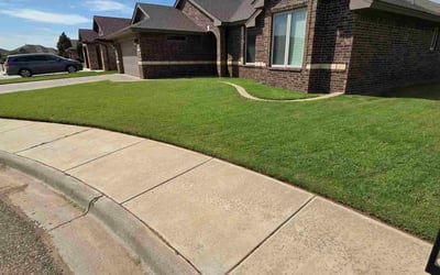 Photo of Jaime D.'s yard after getting lawn care in Clinton, TN