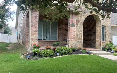 Photo of Kristi B.'s yard after getting lawn care in Lancaster, TX