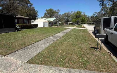 Photo of Mitzi M.'s yard after getting lawn care in Miami Gardens, FL