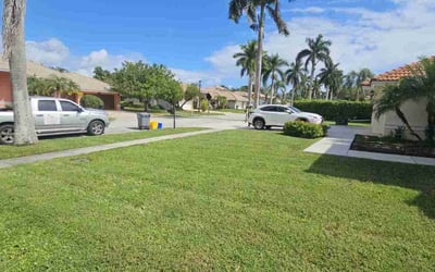 Photo of Jasmine M.'s yard after getting lawn care in Boca Raton, FL