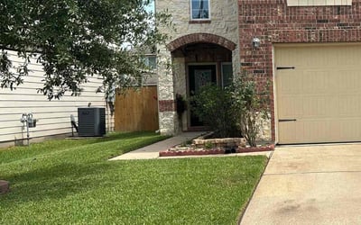 Photo of Clodiane G.'s yard after getting lawn care in Crosby, TX