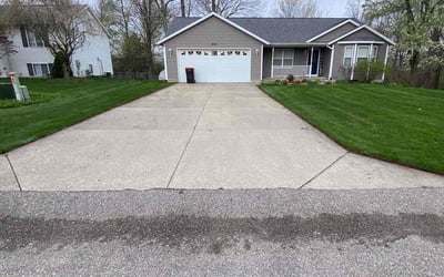 Photo of Holly M.'s yard after getting lawn care in Greenville, MI