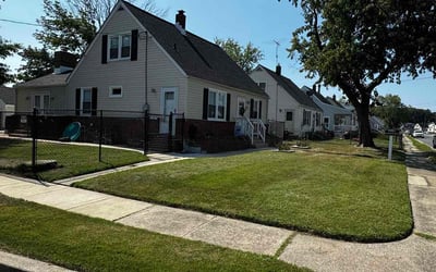 Photo of Anna L.'s yard after getting lawn care in Dundalk, MD