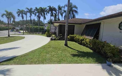 Photo of Rosemary M.'s yard after getting lawn care in Boynton Beach, FL
