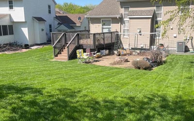 Photo of Melani W.'s yard after getting lawn care in Champlin, MN