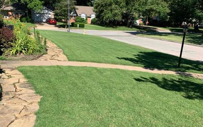 Photo of Christine O.'s yard after getting lawn care in Sand Springs, OK