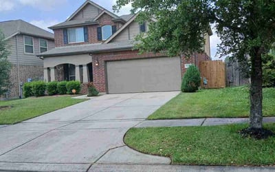 Photo of Liza B.'s yard after getting lawn care in Porter, TX